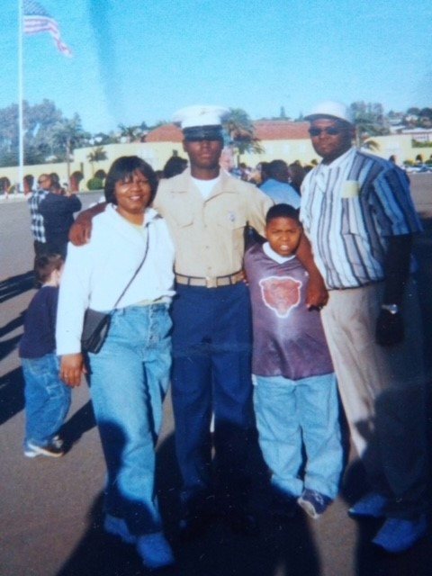 Donald Harris in uniform with family at recruit graduation